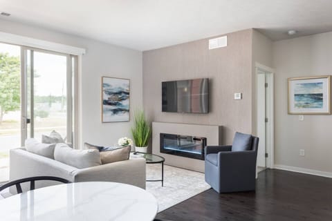 Open, light-filled living space with cozy fireplace and easy patio access—your spot to unwind after a day on the trail