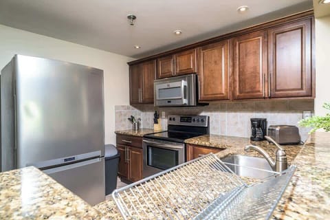 Cook up memories in this fully equipped kitchen with granite countertops—ideal for long stays or weekend escapes.

