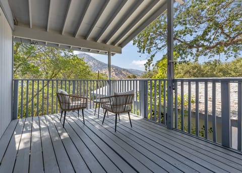 Enjoy a view of the mountains under the shade on your own private balcony