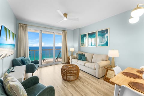 Bright living room with Gulf views, a smart TV, and a queen pull-out sofa—perfect for relaxing after beach days.