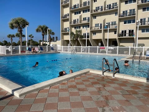Dive into comfort with our indoor-outdoor heated pool. 