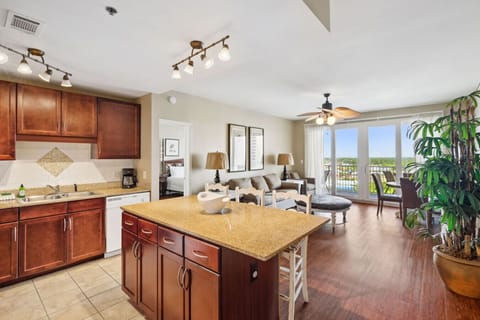 Lakefront Living Area with Sleeper Sofa, Dining Area, Flat Screen TV and Privately Furnished Balcony Access