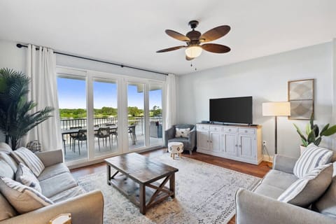 Living Area with Lake and Light Show Views, Flat Screen TV, Sleeper Sofa and Private Balcony Access