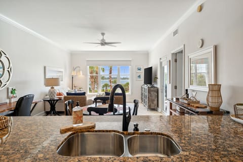 The fully equipped kitchen features granite countertops and stainless-steel appliances.