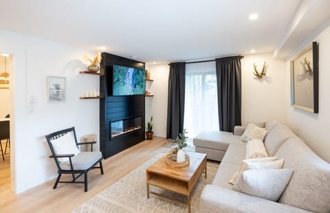 A beautiful electric fireplace creates the perfect ambiance for our guests. Enjoy curling up on the comfortable couch with a great book and look out the window to the alpine and mountainous views.