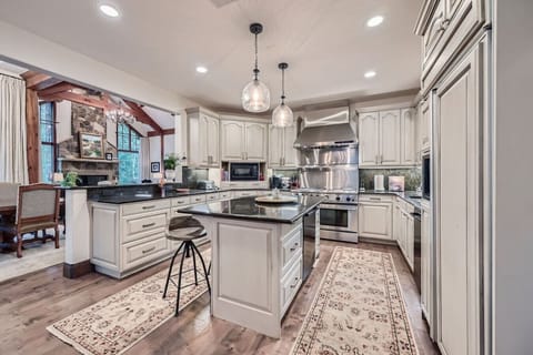 Experience culinary perfection in our chef`s kitchen, featuring top-of-the-line appliances, sleek granite countertops, and custom cabinetry. The spacious layout is perfect for entertaining, while the stylish design invites creativity and gourmet explorati