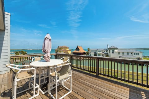 Sip your morning coffee on this spacious deck overlooking tranquil waterfront homes and glistening bay waters.