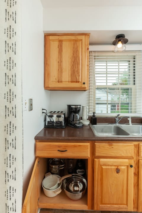 Tea kettle, coffee maker, blender, toaster, pots, pans, Tupperware, mixing bowls