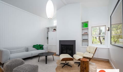 Living room with fireplace and TV
