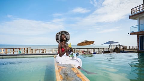 Outdoor pool, open 7:00 AM to 9:00 PM, pool umbrellas