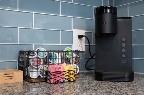 Coffee maker with sugar and cream. 