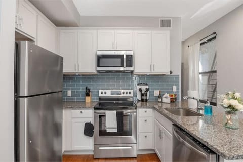 Fully equipped kitchen with large appliances. 