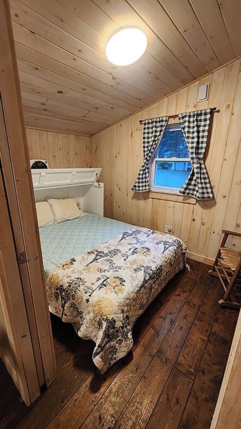 Bedroom includes queen foldaway bed