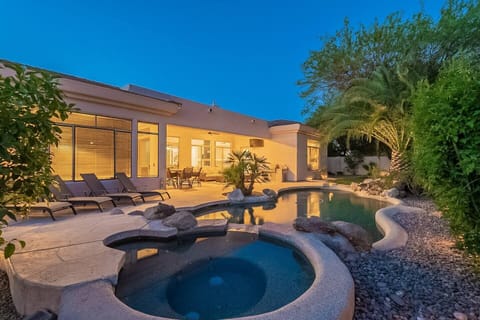 Spectacular backyard with heated pool and jacuzzi.