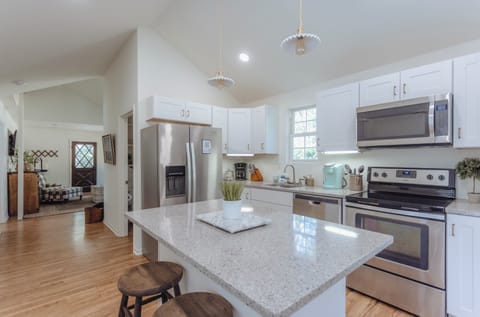 Cottage kitchen with stainless steel appliances