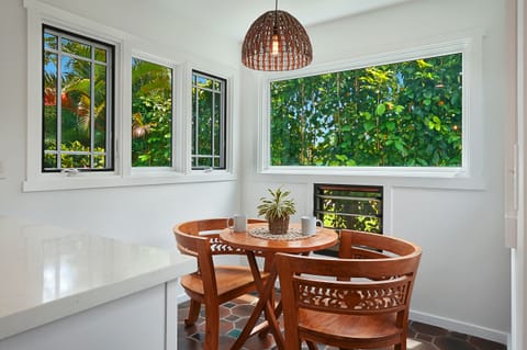 Breakfast nook full of tropical light, perfect for enjoying your morning coffee with island vibes.