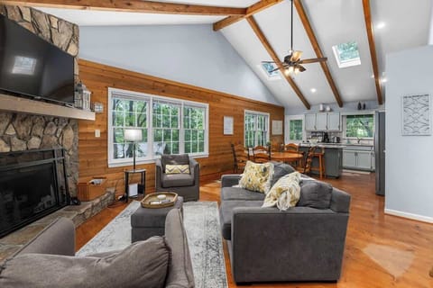 Living Room: Experience bright open spaces with rustic charm and stunning nature views!