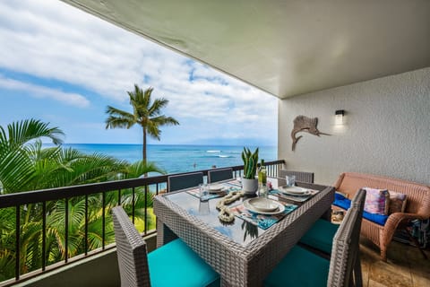 Enjoy meals overlooking the sparkling blue ocean and swaying palm trees