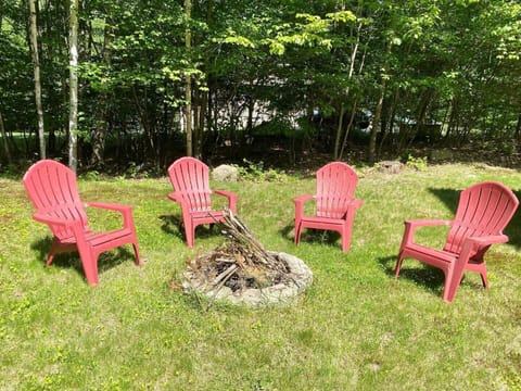fire pit and seating in back yard