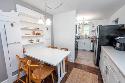 Coffee bar next to dining table that seats 4-5