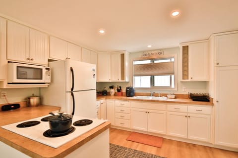 An updated kitchen filled with all your cooking needs.