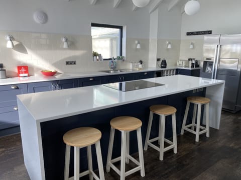 Enjoy a glass of wine and chat to the chef while they prepare dinner! 