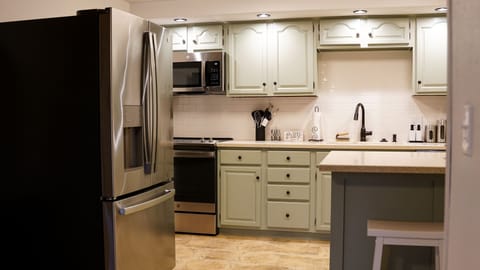Full Kitchen- refrigerator, stove, oven, microwave, dishwasher 