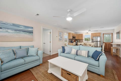 Relax in the spacious Living Area with wooden floors and a bright interior.