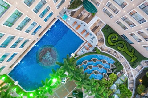 Seasonal outdoor pool, open 2:00 PM to 8:00 PM, pool umbrellas