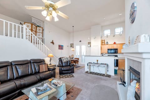 Living room with leather recliner sofa, recliner, 50" Smart TV & gas fireplace