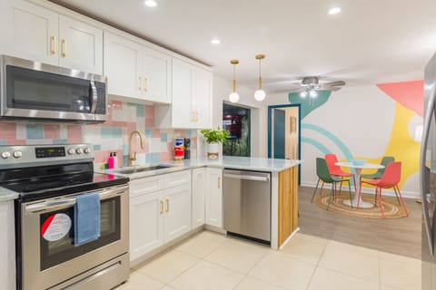 Open concept kitchen with all the utensils, pots, pans, blender, rice maker, toaster, etc you would expect to be able to cook a great meal for your family and friends! 2 dining rooms and bar-top seating can accommodate your entire group!