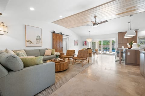 Open-concept living room with stylish coastal décor