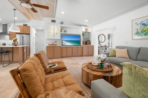 Great room with vaulted ceiling and natural tones