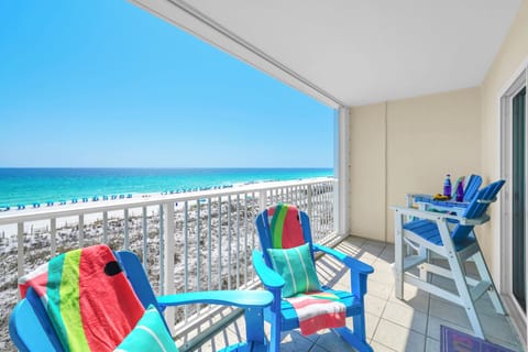Wake up to stunning ocean views from your private balcony, where colorful beach chairs await your morning coffee ritual.
