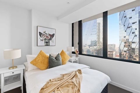 The master bedroom with s queen sized bed & plush pillows.