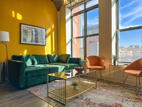 Spacious living room with a lot of daylight and large windows.
