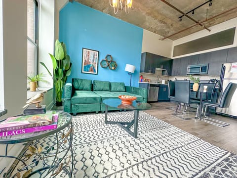 Spacious living room with a lot of natural light and large windows.
