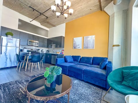 Spacious living room with a lot of natural light and large windows