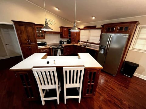 Gourmet Kitchen: Whip up culinary delights in this spacious, stylish kitchen with island seating!