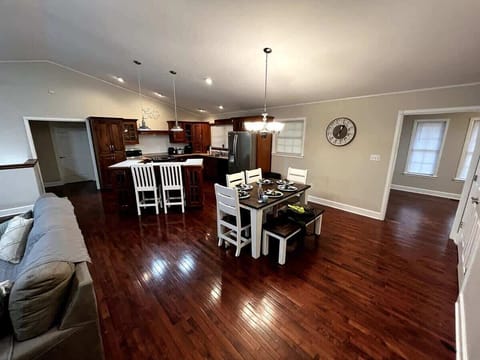 Bright and inviting space for family feasts and laughter under elegant lighting!