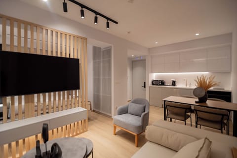 Junior Suite | Living area | 55-inch Smart TV with digital channels