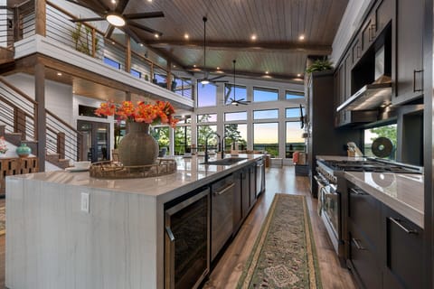 The kitchen flows into the family room and leads to the staircase as well.