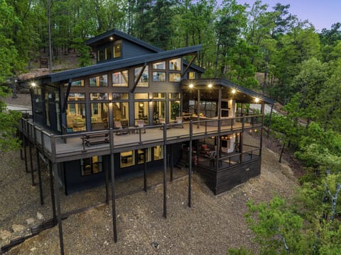 Perched on the mountain side with endless views, 6 bedrooms, 7 bathrooms, and endless amenities inside out out!