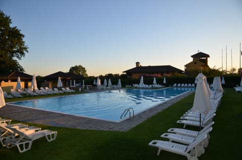 Seasonal outdoor pool, pool umbrellas, sun loungers