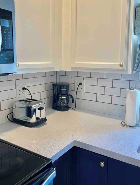 Coffee maker with coffee filters and coffee stocked, enjoy with one of our mugs!