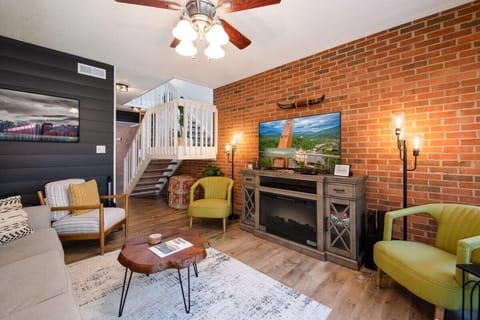 Living room with smart TV leading out to patio area