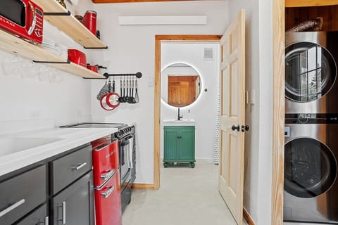 This unique place has a style all its own. Featuring LED makeup mirror with defogger, a fully stocked kitchen, and a full-size washer and dryer.