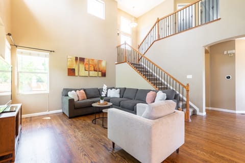 Living room #1: High ceiling with abundance of natural light, bright and warm