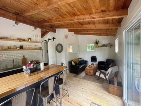 Beautiful custom kitchen and living room. All well appointed.