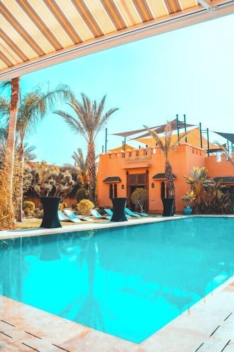 Outdoor pool, open 10:00 AM to 7:00 PM, pool umbrellas, sun loungers